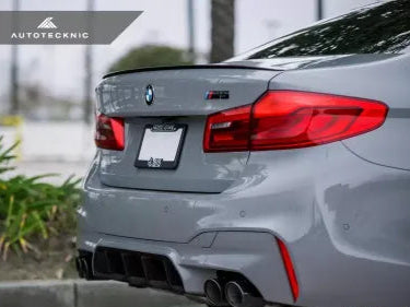 BMW F90 M5 with AutoTecknic rear diffuser installed (rear angle)